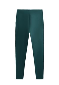 Zelene, prilegajoče atletske legice z gladko teksturo, ki imajo visok pas in ukrivljen šiv na hrbtni strani.