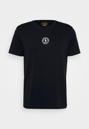 Black cotton t-shirt with a round neckline, short sleeves, and a circular logo on the chest featuring a horseman design.