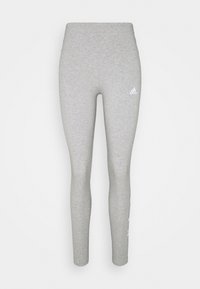Grå atletiska leggings gjorda av elastisk tyg, med hög midja och en liten vit Adidas-logotyp på vänster höft.