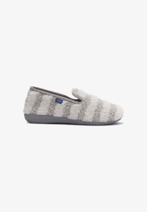 Chausson en fausse fourrure grise et blanche à rayures avec une semelle grise et une petite étiquette de logo Scholl bleue sur le côté, présenté de profil.