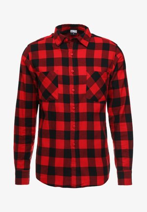 Red and black plaid flannel shirt with button-up front, long sleeves, and two chest pockets. Textured fabric with checkered pattern.