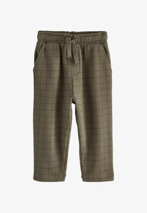 Pantalon de survêtement vert olive avec une taille élastique, un cordon de serrage, des poches latérales et un motif en grille noire sur l'ensemble. Tissu doux et texturé.