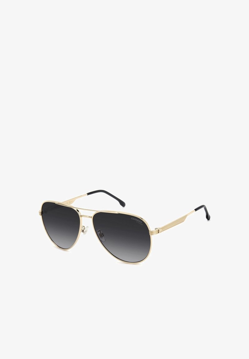 Lunettes de soleil aviateur à monture métallique dorée, verres dégradés noirs et branches noires, présentées en angle trois-quarts.