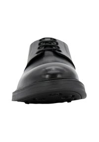Stivale in pelle nera con punta arrotondata, design con lacci e suola in gomma texturizzata con modelli di aderenza per una buona presa.
