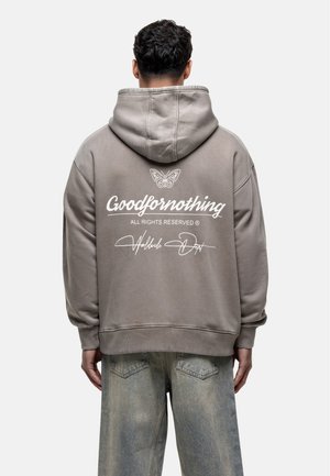 Gray hooded sweatshirt with a back logo. Features a butterfly design and text reading "Goodfornothing" in white. Made from soft fabric.