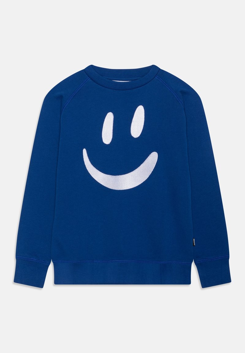 Sweat-shirt bleu en tissu doux, avec un motif de visage souriant blanc sur le devant. Conception décontractée avec poignets et col côtelés.