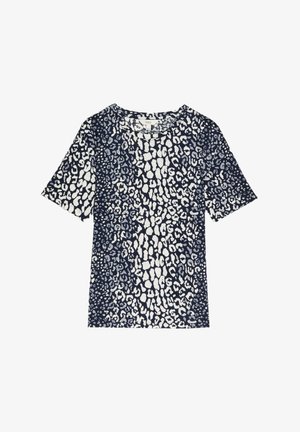 T-shirt à manches courtes bleu marine et blanc avec un motif léopard aux formes et tailles variées, col rond, en tissu mélange de coton.