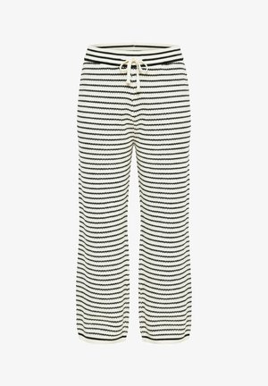 Pantaloni a righe orizzontali bianche e nere, lavorati a maglia, con vita a coulisse e gambe larghe.