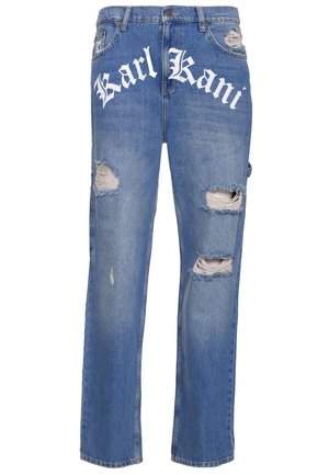 Blue denim jeans with a relaxed fit, featuring large rips on the front and "Karl Kani" logo in white script across the waistband.