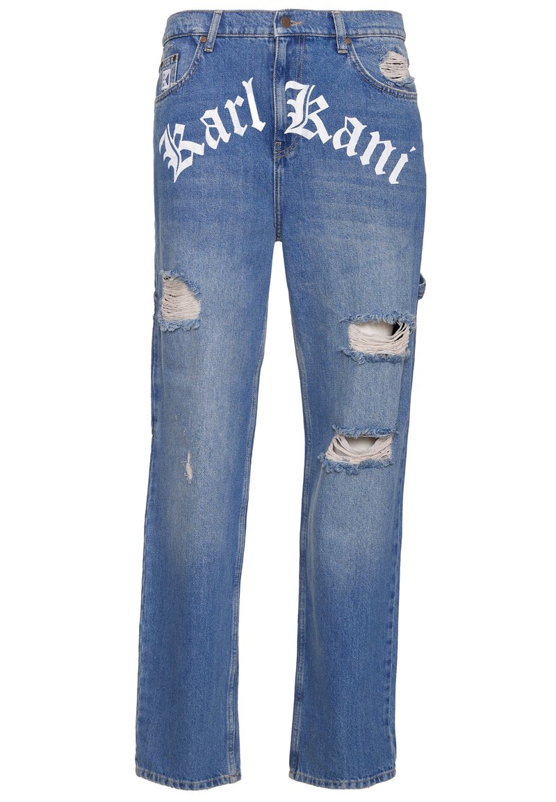Mėlyni džinsai iš džinso medžiagos, laisvo kirpimo, su didelėmis plyšiais priekyje ir baltu "Karl Kani" logotipu ant juosmens juostos.