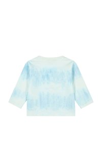Dlouhý rukáv tričko vyrobené z měkké bavlny s světle modrým tie-dye vzorem. Má kulatý výstřih a volný střih.