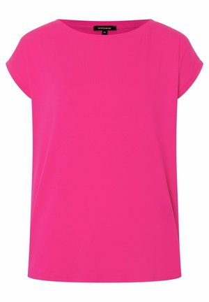 Top de manga corta, de un brillante color rosa, con escote redondeado. Hecho de una tela suave, con un corte holgado y sin patrones ni acentos visibles.