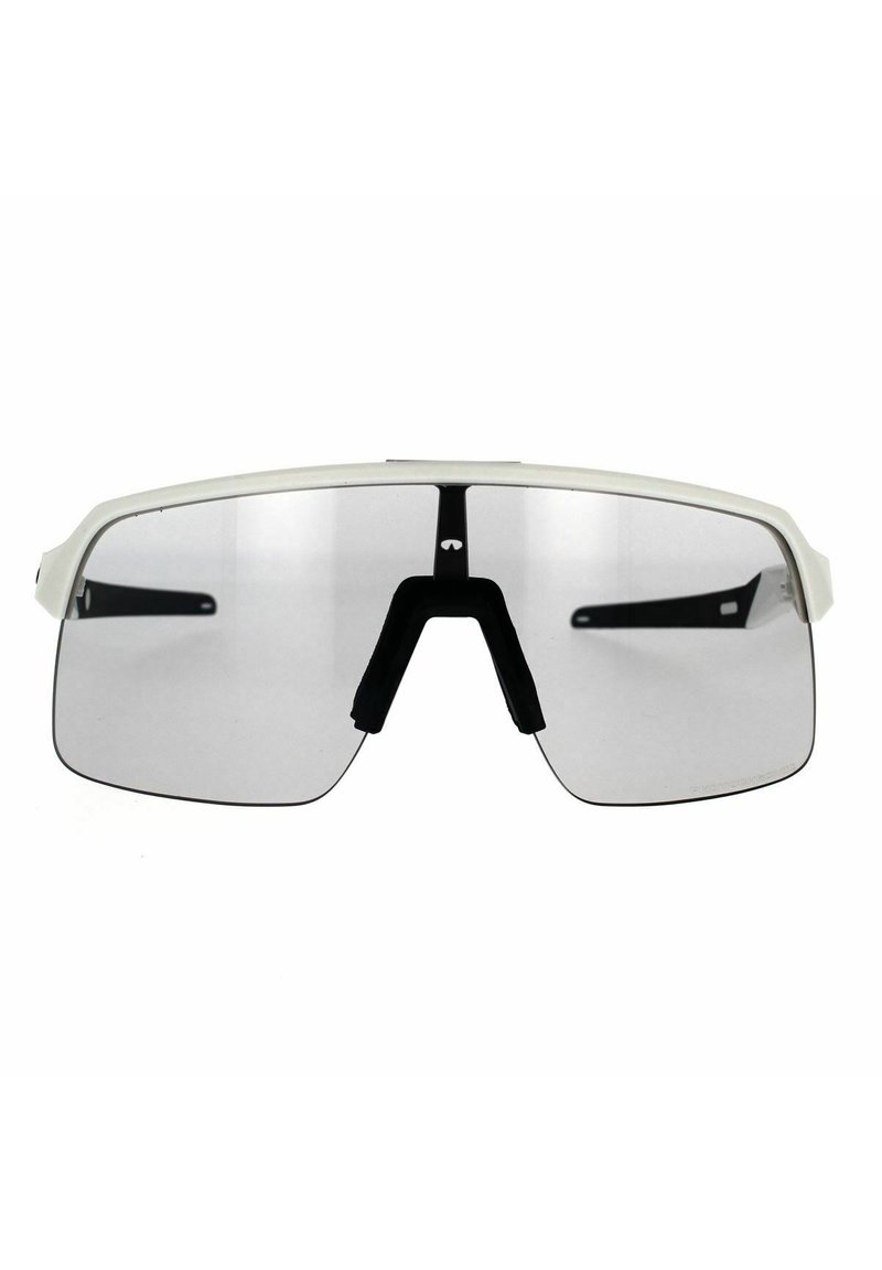 Sunglasses with a white frame and gray lenses. Features a wide design, a bridge support with a black rubber insert, and black side arms.