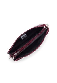 Portefeuille zippé bordeaux avec intérieur noir, extérieur lisse et accent en métal argenté. Comprend deux compartiments pour l'organisation.