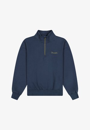 Laivastonsininen pitkähihainen pusero, jossa on neljännesvetoketjullinen kaulus ja pieni keltainen "Wrangler"-logo ommeltuna rintaan.