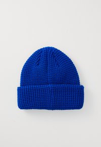 Knitted blue beanie with a textured pattern, featuring a folded brim and rounded top. Made of soft, warm fabric suitable for cold weather.