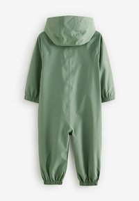 Grüner wasserdichter Overall mit Kapuze, elastischen Bündchen und glatter Textur; zeichnet sich durch eine lockere Passform und ein minimalistisches Design aus.