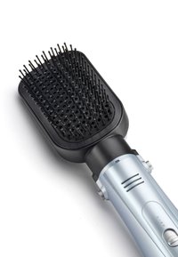 Black rectangular electric hairbrush with rounded bristles and silver handle featuring a power switch and air vents.