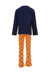 Navy long-sleeve shirt paired with orange pajama pants featuring a black circular logo pattern. Cotton fabric, relaxed fit, simple design.