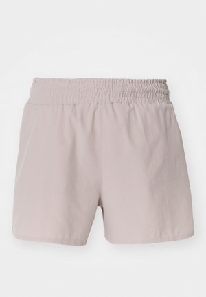 Svetlo bež kratke hlače z elastičnim pasom, gladko teksturo in preprostimi oblikami. Brez vidnih zapiranj ali vzorcev.