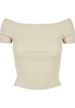 Off-shoulder, kortärmad ribbad topp i ljusbeige. Har en åtsittande silhuett och mjuk textur med en sömlös finish.
