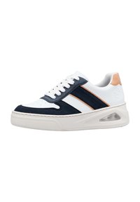 White sneaker with navy suede accents, two navy stripes, and a light brown heel tab. Features a thick white sole with a visible air unit.