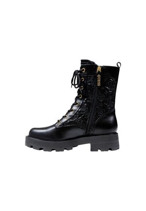 Black leather lace-up boot with chunky sole, side zipper with GUESS branding, and quilted patterned upper section.