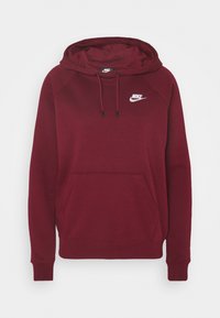 Bordeauxblå hoodie med framficka, dragsko i huva och en vit Nike-logotyp på bröstet. Tillverkad av mjukt, texturerat material.