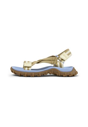 Sandalia de tiras a rayas beige y blancas con plantilla azul y suela marrón resistente, diseñada para uso al aire libre y ajuste ajustable.