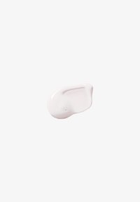 Crema rosa chiaro con una consistenza liscia e lucida, caratterizzata da una leggera lucentezza e da alcune piccole bolle. Forma curva e asimmetrica.