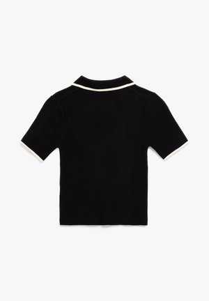 Polo shirt noir à manches courtes avec un col blanc et des accents de manches. Fabriqué en tissu texturé, avec une coupe et un design classiques.