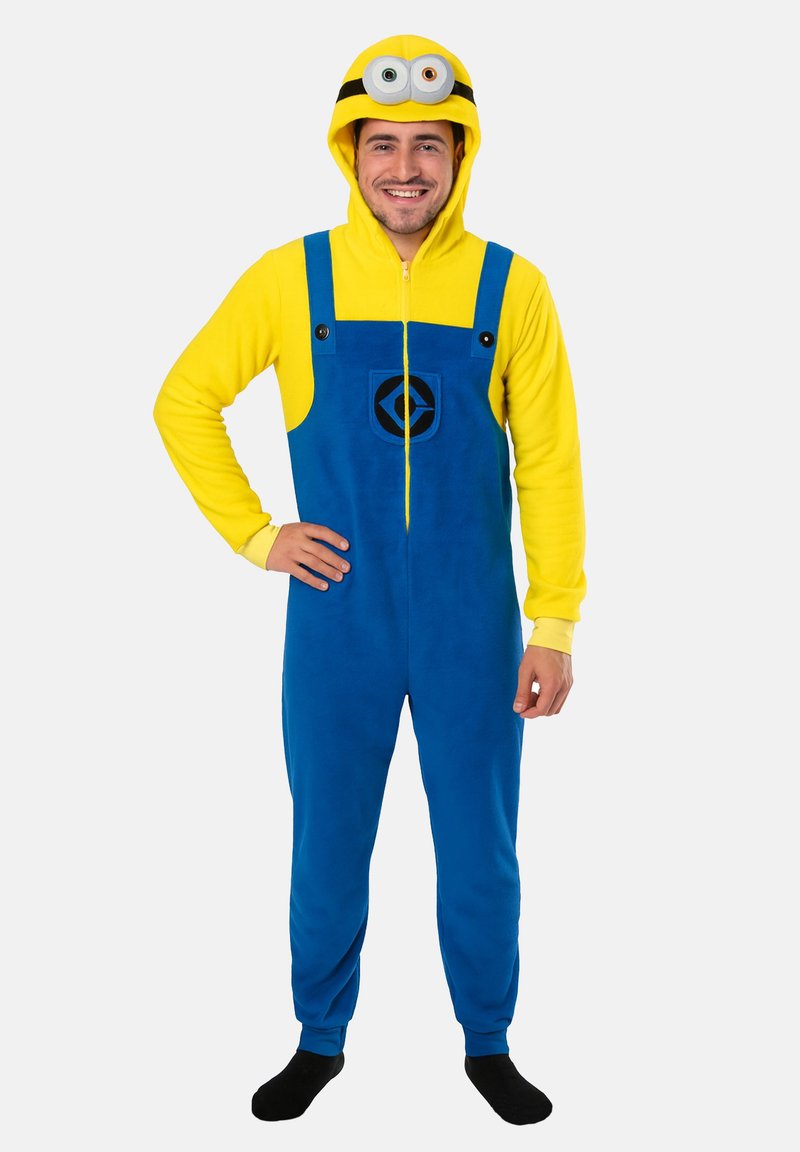 Tuta a maniche lunghe gialla e blu con cappuccio, caratterizzata da un design di un Minion, con chiusura a zip frontale, bottoni neri e taschino rotondo con logo. Materiale in morbido pile.