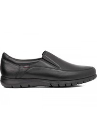 Scarpa slip-on nera in pelle con superficie liscia, punta arrotondata, аксессori laterali elastici e suola in gomma testurizzata per una buona aderenza.