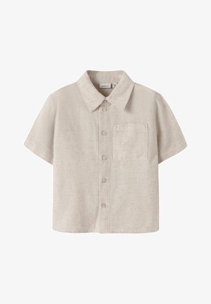 Μπέζ κοντομάνικο πουκάμισο με κουμπιά και γιακά, με μία μόνο τσέπη στο στήθος, φτιαγμένο από υφασμένο ύφασμα.