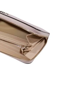 Wallet with a light pink textured exterior, gold zipper, and inner compartments for cards and coins, featuring beige lining and zippers.