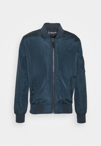 Veste bomber bleu marine en nylon lisse. Comprend une fermeture éclair à l'avant, des poignets côtelés et des poches latérales. Logo discret sur la poitrine.