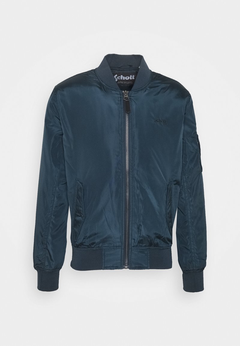 Veste bomber bleu marine en nylon lisse. Comprend une fermeture éclair à l'avant, des poignets côtelés et des poches latérales. Logo discret sur la poitrine.