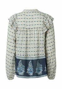 Blusa a maniche lunghe con spalle volant, con uno sfondo beige e motivi floreali blu, e un orlo blu scuro con disegni floreali più grandi.