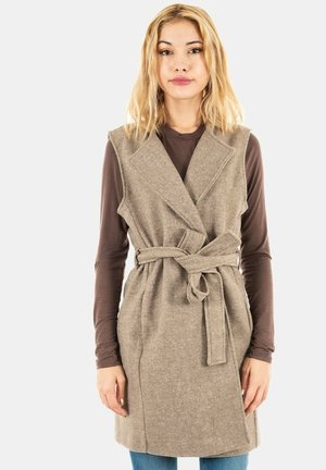 Beige wollen mixvest met een wikkelontwerp, diepe V-hals en een riem om de taille. Het heeft zijzakken en een gestructureerde afwerking.