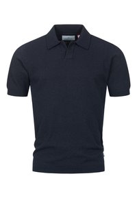 Marineblå kortermet polo skjorte laget av myk strikket stoff. Har klassisk krage og ribbede kanter. Minimalistisk design, uten mønstre.