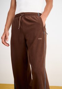 Rains ADDIS PANTS WIDE UNISEX - Tepláky - frame