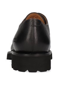 Zwarte leren dresschoenen met een ronde teen en een gestructureerde afwerking. Stevige rubberen zool met een profiel, met een minimalistisch ontwerp.