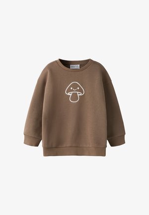 Sweat-shirt marron à manches longues avec un graphique d’un champignon blanc souriant sur la poitrine, poignets et ourlet côtelés.