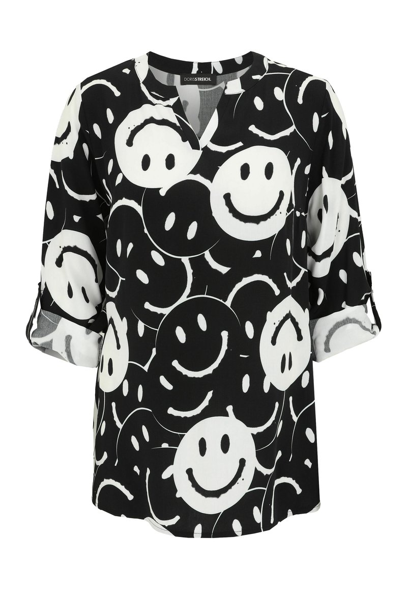 Black and white blouse with a v-neck, featuring a pattern of smiling faces. Made from soft fabric with three-quarter sleeves and roll-up cuffs.