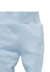 Lichtblauwe sweatpants met een geribde tailleband, gemaakt van een zachte, gestructureerde stof en een eenvoudig ontwerp, ontworpen voor een comfortabele pasvorm.