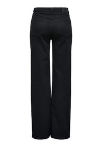 Jean large noir avec poches arrière et taille haute, vu de dos sur un fond blanc.