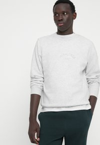Jack & Jones JORBLEECKER BRANDING CREW - Sportinis megztinis - bright white melange