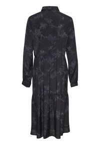 Mörk långärmad klänning med subtilt blommönster, hög midjesöm, veckad kjol och knäppta manschetter, visad bakifrån.