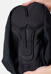 Schwarzer, gepolsterter Radsport-Shorts-Einsatz mit strukturiertem Oberflächen und konturiertem Shape für Komfort. Material wirkt weich mit erhöhten Punkten für besseren Halt.