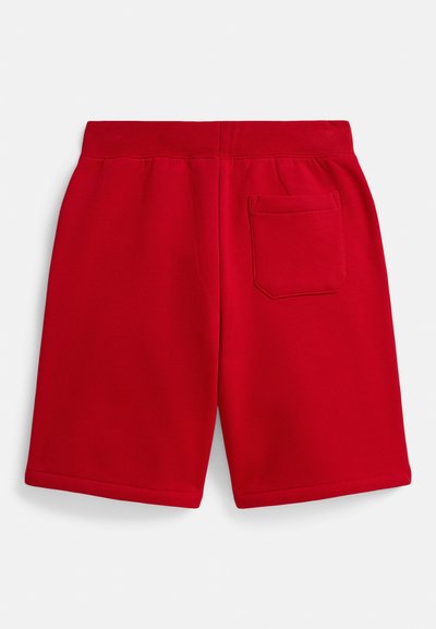 Calções vermelhos de algodão com cintura elástica, com um bolso aplicado nas costas e uma textura suave. A bainha está acabada com uma costura simples.